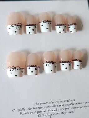 White and black polka dot & bow french tip press-on nail set. Size Small.
